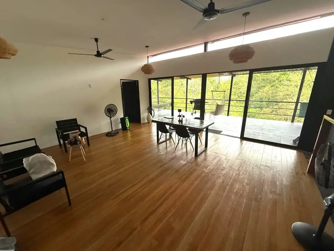 Discover this contemporary gem nestled in Costa Rica’s pristine nature. Just minutes from Puerto Jiménez, this two-level home sits on a peaceful hillside in the ...
