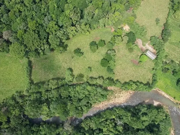 Riverfront Farm for Sale – 21.7 Acres of Flat Land with Forest and Development Potential
